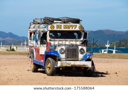 CORON, PHILIPPINES  - FEBRUARY 07, 2014  :Jeepneys passing, Philippines inexpensive bus service. Jeepneys are the most popular means of public transportation in the Philippines.