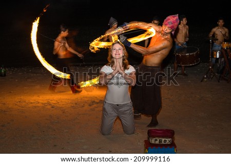 PANGLAO, PHILIPPINES - FEBRUARY 20, 2014 :Fire show festival at the beach. Unidentified man performing a dance with fire. Philippines is one of the top tourist destinations in the world.