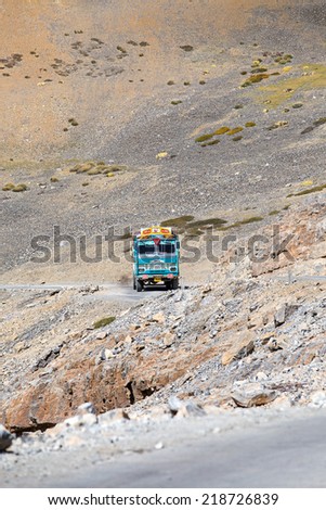 LADAKH, INDIA - SEPTEMBER 09 2014: Truck on the high altitude Manali-Leh road in Lahaul valley, state of Himachal Pradesh, Indian Himalayas, India