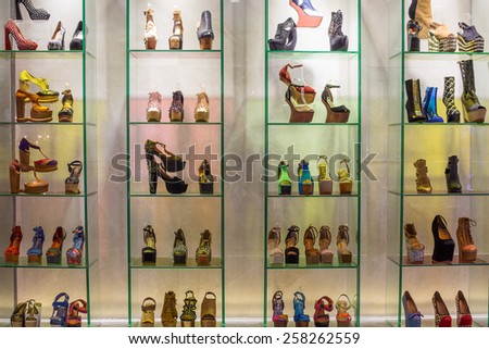 BANGKOK, THAILAND - NOVEMBER 19, 2013 : Lot women shoes brand name - Jeffrey Campbell Shoes on a glass shelf at the Siam Paragon Mall. Siam Paragon is a one of the biggest shopping centres in Asia.