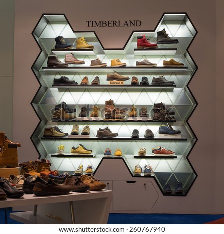 BANGKOK, THAILAND - NOVEMBER 19, 2013 : Lot shoes brand name - Timberland on a glass shelf at the Siam Paragon Mall. Siam Paragon is a one of the biggest shopping centres in Asia.