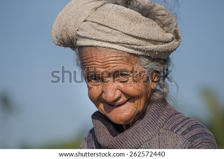 UBUD, BALI, INDONESIA - MARCH 19, 2015 : Unidentified old poor woman to Bali island. Inhabitants of Bali are kind and friendly even in old age