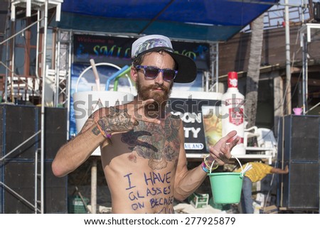 PHANGAN, THAILAND - JANUARY 5, 2015: Unidentified man participate in the Full Moon party on island Koh Phangan. The event now attracts about 40,000 party-goers every month