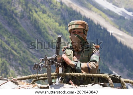 JAMMU AND KASHMIR, INDIA - JUNE 12, 2015 : Unknown Indian frontier guard. Indian Army checkpoint in Kashmir Himalayas. Kashmir became dangerous again.