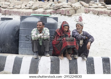 LEH, INDIA - JUNE 29, 2015 : Unidentified tibetan poor men on the streets in Ladakh, North India