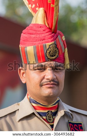 ATTARI, INDIA - SEPTEMBER 29, 2014: Unknown Indian frontier guard at the Indian - Pakistani border during the border closing ceremony