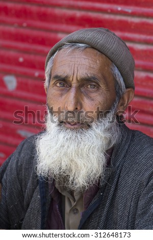 SRINAGAR, INDIA - JULY 03 2015: Unidentified Indian muslim man on the street. Kashmiris are fighting for their freedom for 20 years now. Kashmir became dangerous again.