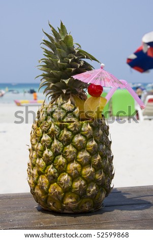 Tropical pineapple cocktail drink at the beach overlooking the ocean