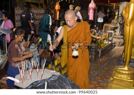 CHIANG MAI, THAILAND - NOVEMBER 11:Thai people are praying for a religious ceremony in the Doi Suthep temple during the Loy Krathong festival in Chiang Mai, Thailand on November 11, 2011