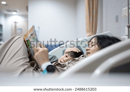 Image, Stock Photo Mother nursing while read a book