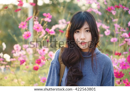 https://image.shutterstock.com/display_pic_with_logo/3530750/422563801/stock-photo-charming-asian-girl-with-beautiful-cosmos-flower-422563801.jpg