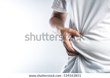 Man touching his fat belly on white background Imagine de stoc © 