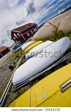 Boats on land in the swedish countryside.