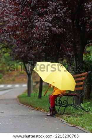 Image, Stock Photo The large, two-legged umbrella walks casually across the windy Heiligengeistfeld