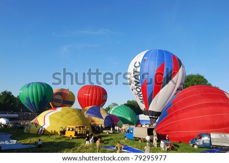 VELIKIE LUKI, RUSSIAN FEDERATION-JUNE 12: Pilots prepare for mass-start at the opening of the XVI-th International Balloon Meet June 12, 2011 in Velikie Luki, RUSSIAN FEDERATION.