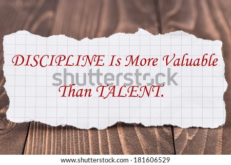 Discipline Is More Valuable Than Talent, written on a piece of paper.