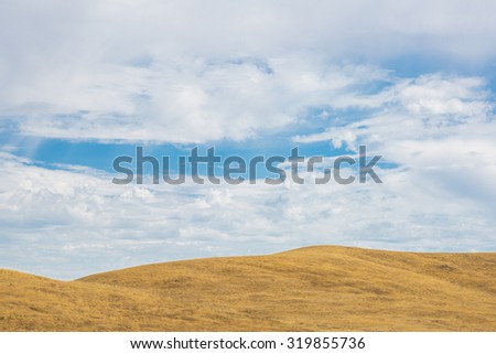 Golden Hills and Blue Sky