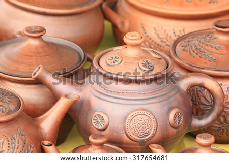 close-up of various dishes from clay handmade in natural light