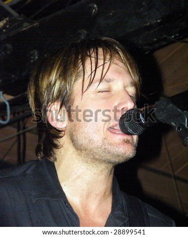 CHICAGO, IL - MARCH 30: Country singer Keith Urban performs a No Frills show at Joe's Bar March 30, 2009 in Chicago, IL. The No Frills show was one of five shows performed and sponsored by Verizon.
