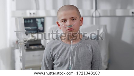 Similar – Image, Stock Photo Sad boy in medical mask near window