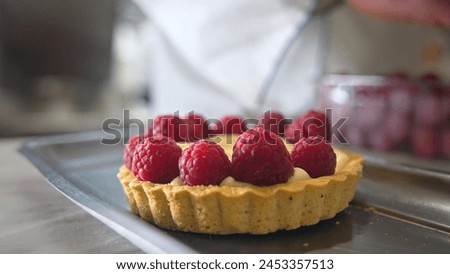 Similar – Foto Bild Männlicher Bäcker schiebt Kuchen in den Ofen