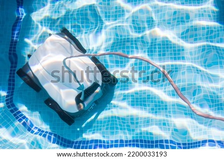 Similar – Image, Stock Photo Swimming pool cleaner robot during vacuum service, maintenance. Top view