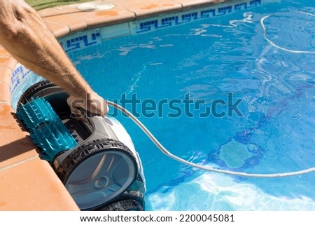 Similar – Image, Stock Photo Swimming pool cleaner robot during vacuum service, maintenance. Top view