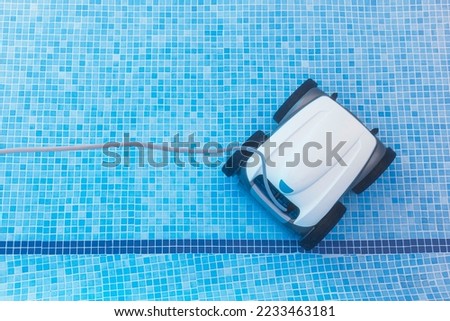 Similar – Image, Stock Photo Swimming pool cleaner robot during vacuum service, maintenance. Top view