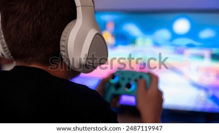 Image, Stock Photo Children playing video game in bed