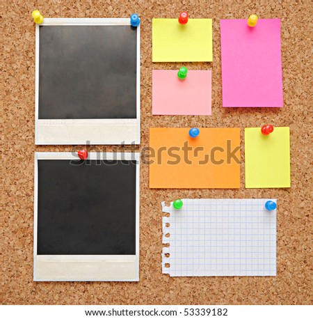 colorful empty notes over brown cork background