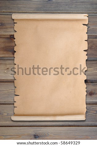 vintage paper scroll over grunge pannel wood background
