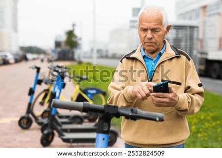 Similar – Image, Stock Photo Activating electric scooter from smartphone