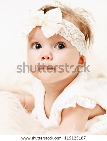 Adorable Portrait of Little Baby Girl in Pink dress dreaming