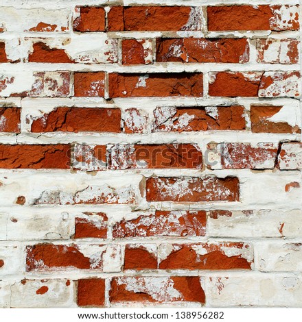 Grungy textured red and white horizontal stone and brick paint architectural wall inside old neglected and deserted interior, masonry and carpentry brickwork concept