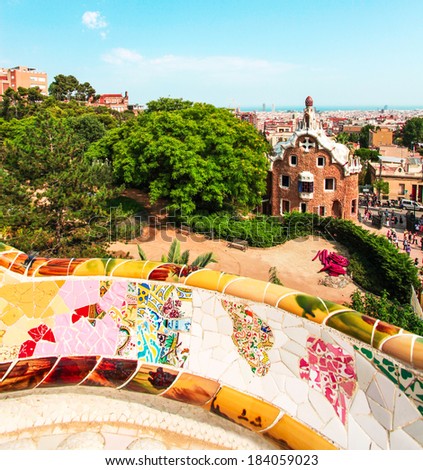 BARCELONA, SPAIN - JULY 19: Ceramic mosaic Park Guell on July 19, 2013 in Barcelona, Spain. Park Guell is the famous architectural town art designed by Antoni Gaudi and built in the years 1900 to 1914