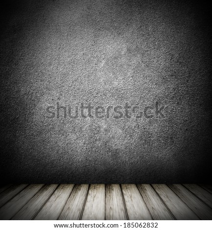 Background of age grungy black texture of paint stucco brick and stone wall with dark wooden floor inside old modern and contemporary empty interior, blank color horizontal space of clean studio room