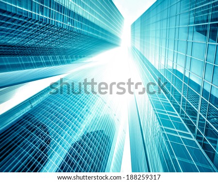 Panoramic and perspective wide angle view to steel light blue background of glass high rise building skyscraper commercial modern city of future. Business concept of successful industrial architecture