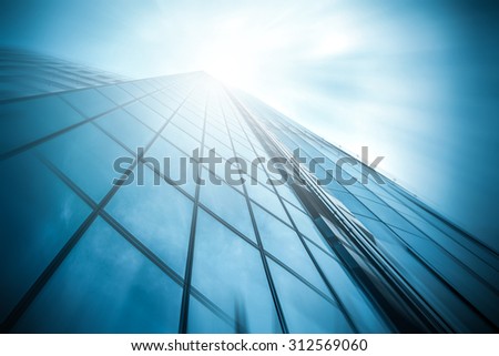 Panoramic and perspective wide angle view to steel light blue background of glass high rise building skyscraper commercial modern city of future. Business concept of success industry tech architecture