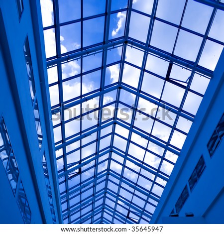 Abstract blue geometric ceiling in office center