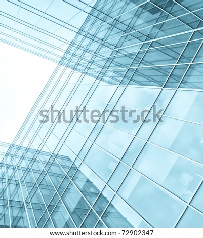 turquoise wall of glass building skyscrapers