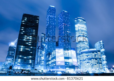perspective view to glass high-rise skyscrapers of Moscow city business center at night