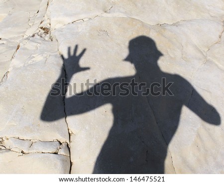 The shadow of the photographer on the coastal cliff