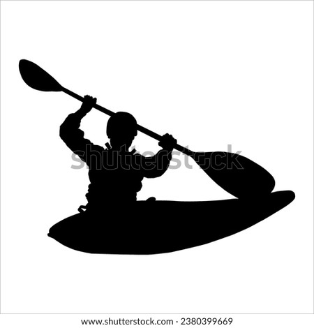Silhouette of a person rowing a canoe