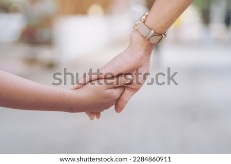 Similar – Image, Stock Photo Mother and son crossing a bridge together