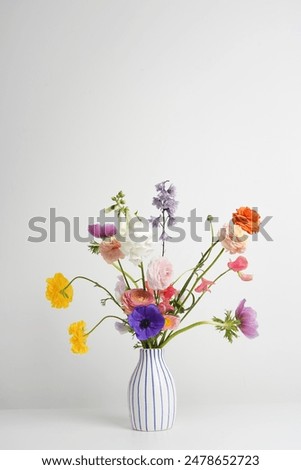 Similar – Image, Stock Photo Vase with colorful flowers on small table