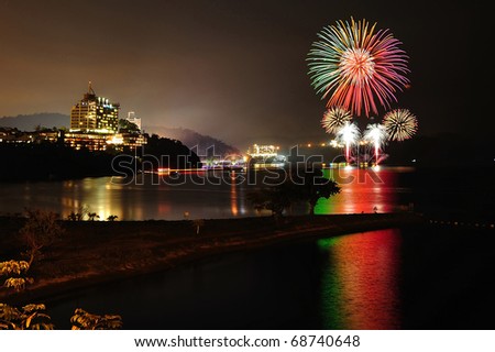 TAIWAN - DEC 31: Fireworks explode over Sun Moon Lake for New Years celebrations on Dec 31, 2010 in Taiwan.