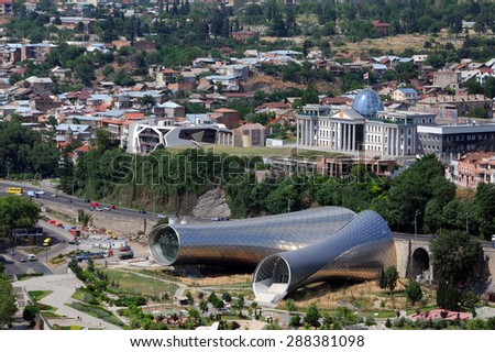 TBILISI, GEORGIA - JUNE 13, 2015: Aerial view of the concert hall and Presidential palace in the capital of Georgia Tbilisi from Narikala fortress
