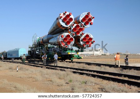 BAIKONUR, KAZAKHSTAN - 13 JUNE: Soyuz launch vehicle is being transported to the launch pad along the railroad tracks at the cosmodrome June 13, 2010 in Baikonur, Kazakhstan