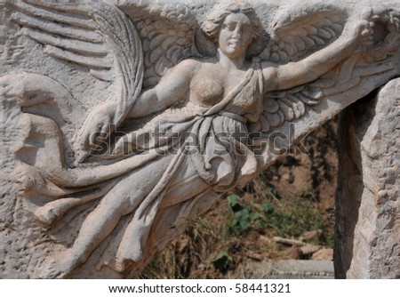 A carving of goddess of victory Nike in ancient city of Ephesus which supposedly used to be a ceiling fragment.
