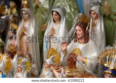 Statue Of Christ Surrounded By Statues Of The Virgin Mary Outside A ...